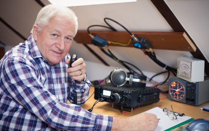 Determined Man Contacts the Space Station With a HAM Radio Man Contacts the Space Station With Ham Radio Determined Man Contacts the Space Station With a HAM Radio