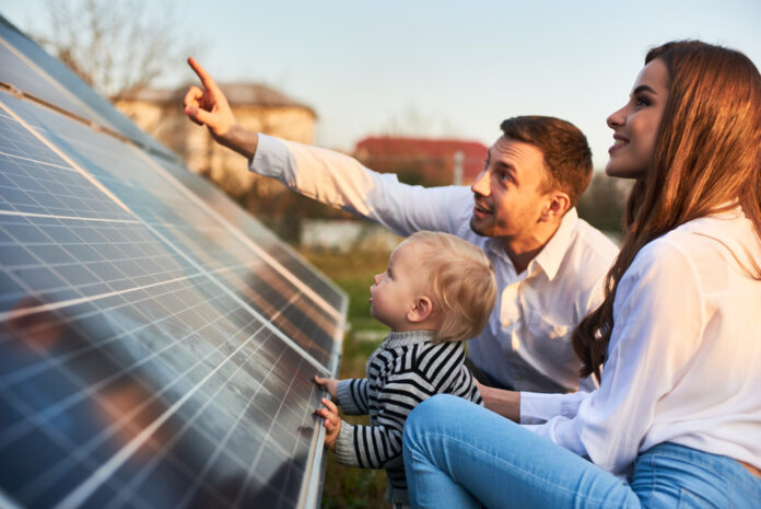 Man,Shows,His,Family,The,Solar,Panels,On,The,Plot Get solar power